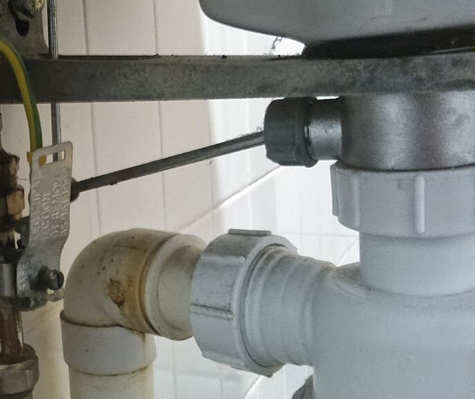 Sink waste trap and connected drain pipe