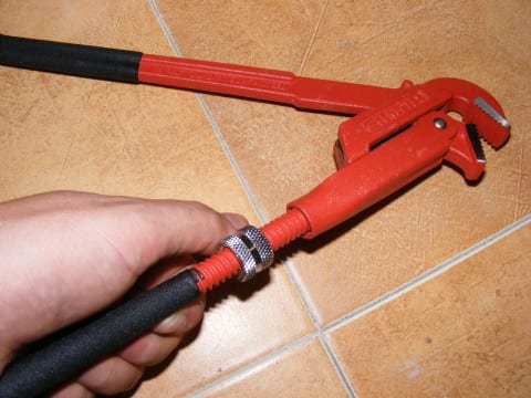 Adjustable pipe wrench and plumbing hand tool